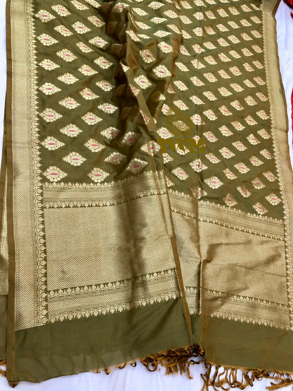 Green and beige patterned fabric with a decorative border on a white background