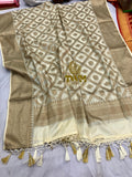 Beige and brown patterned fabric Dupatta with tassels on a plain background