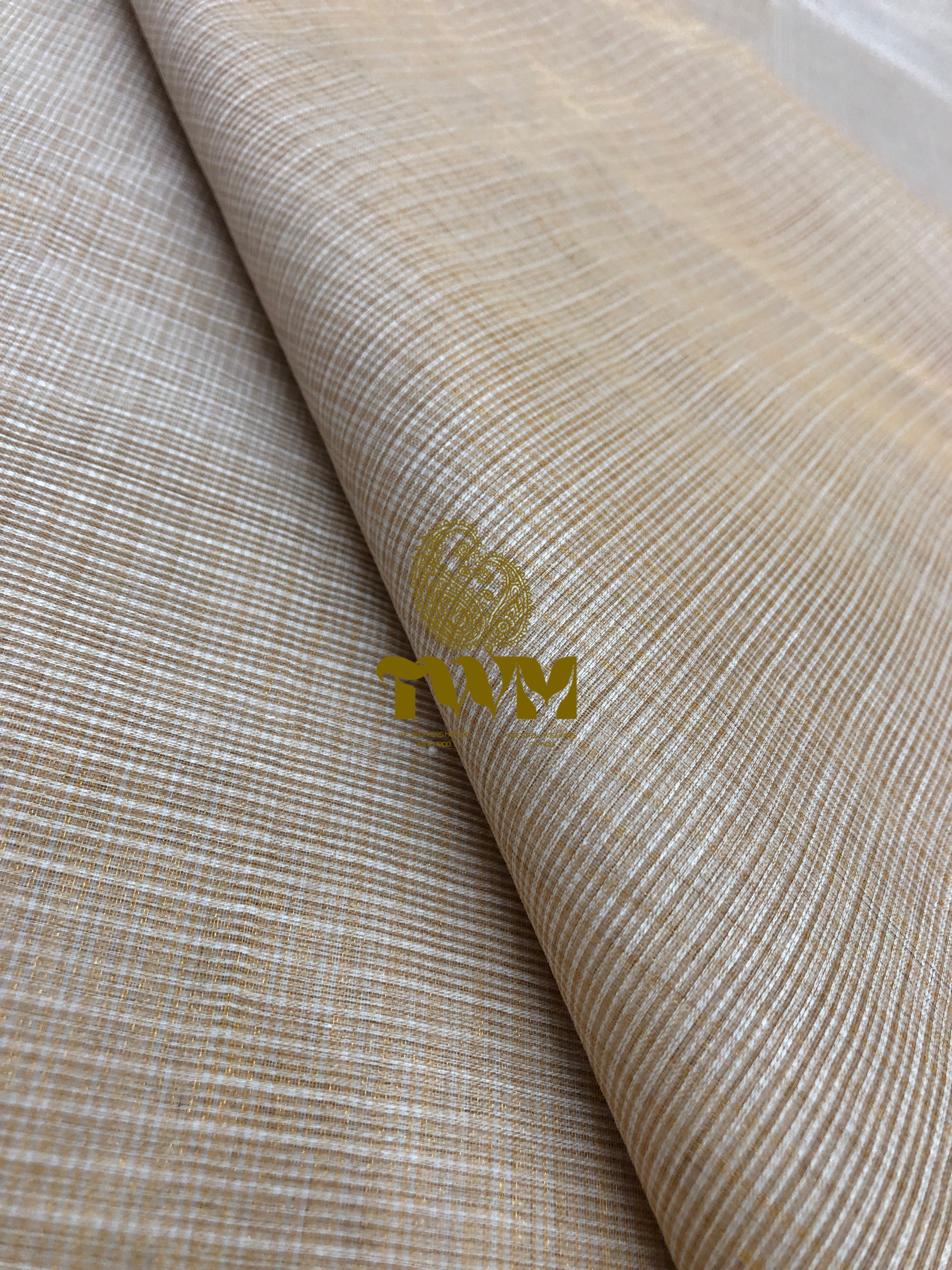 Textured beige fabric with a visible brand logo in the corner