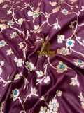 Purple fabric with floral embroidery pattern
