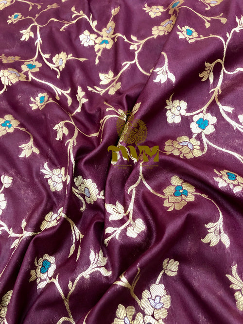 Purple fabric with floral embroidery pattern