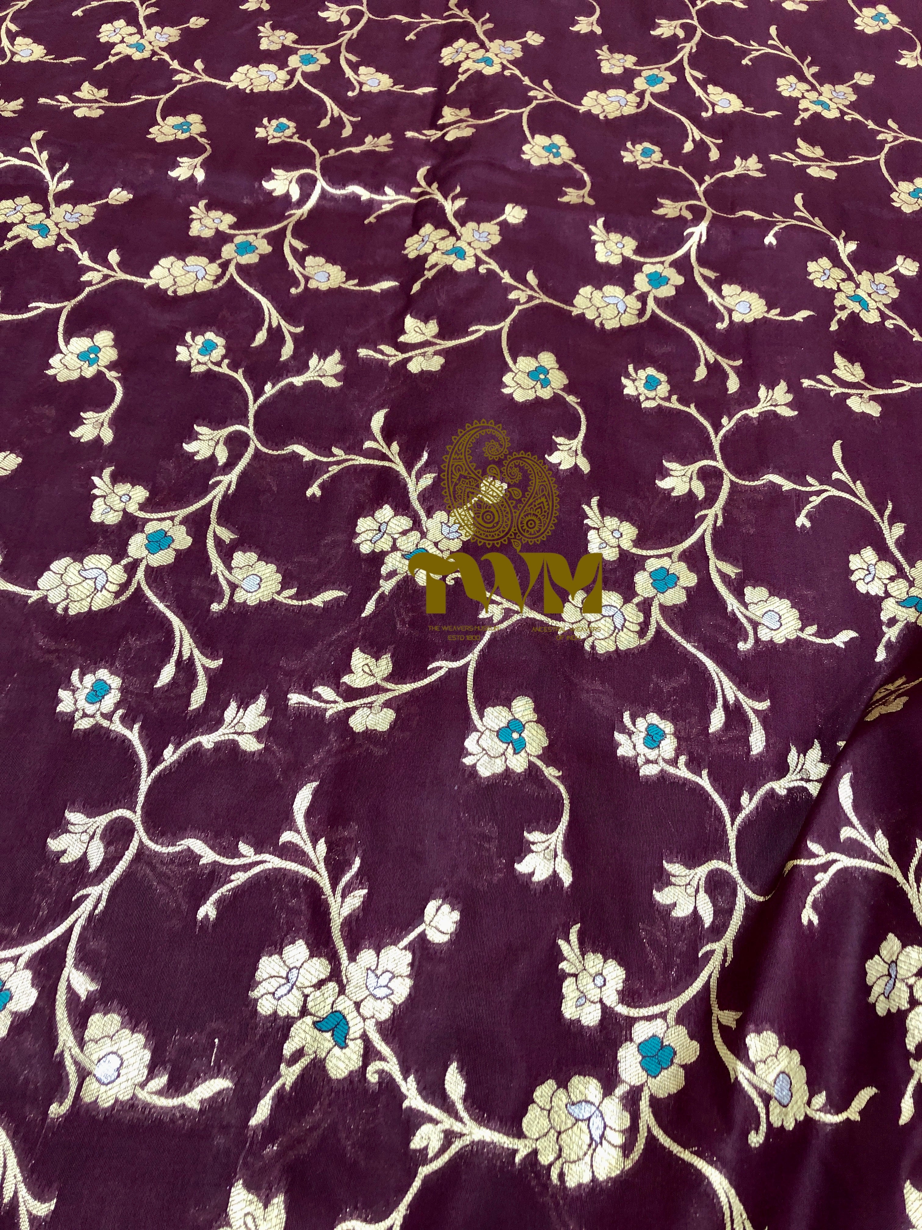 Floral patterned fabric with a brand logo in the corner