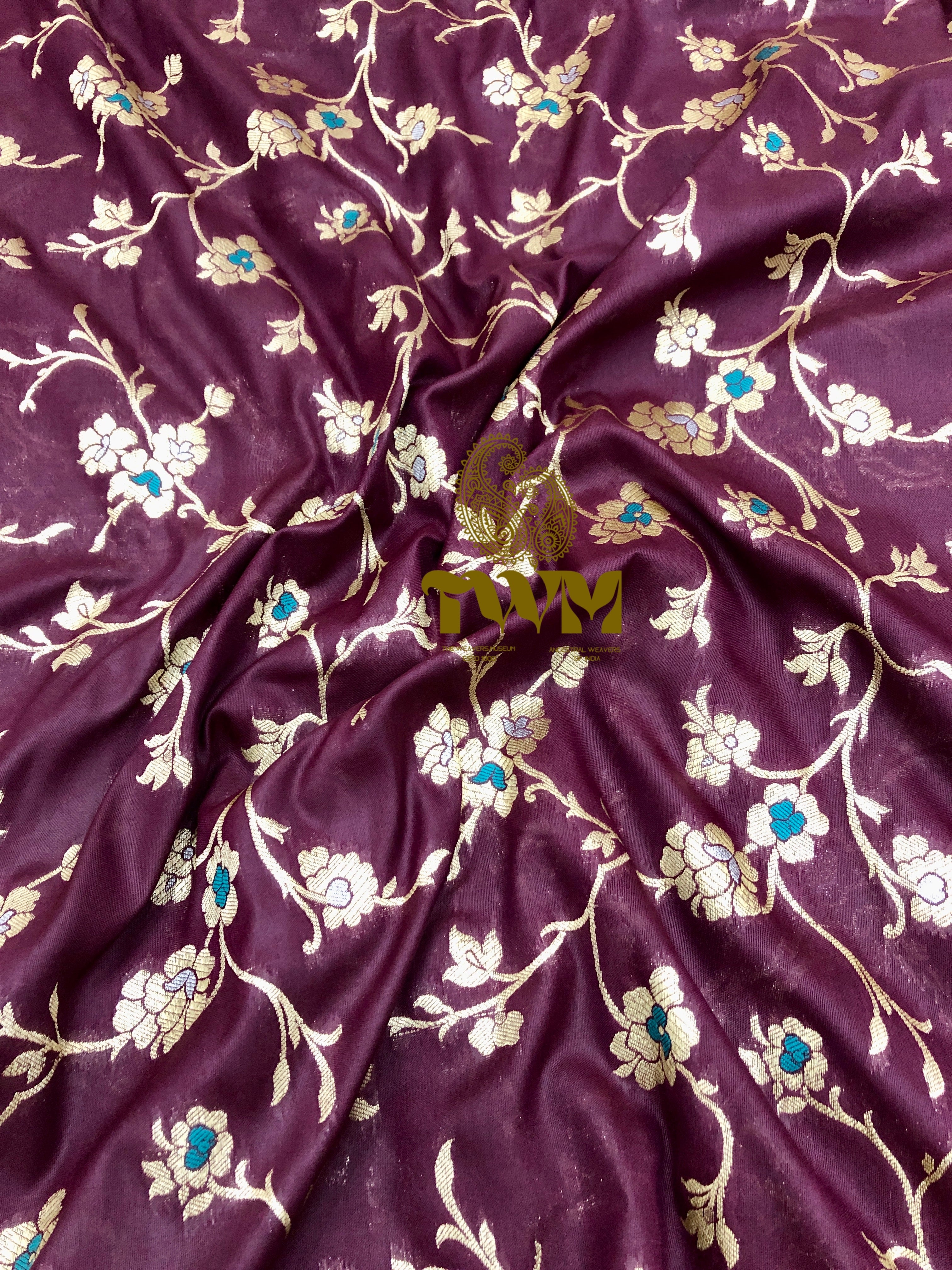 Burgundy fabric with floral embroidery and 'TWM' branding.