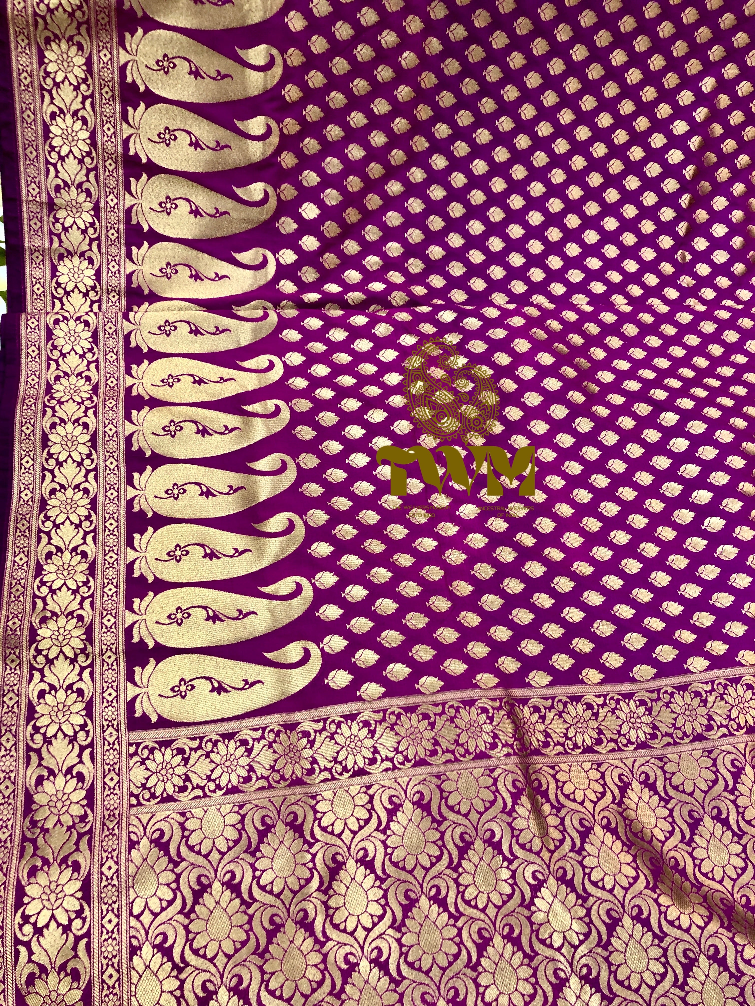 Purple fabric with gold and white patterns