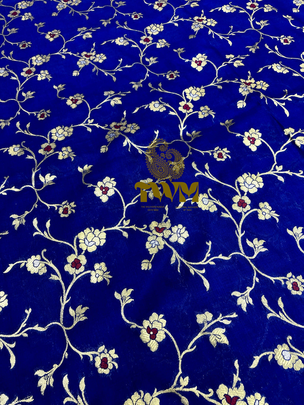 Decorative fabric with floral pattern on a blue background