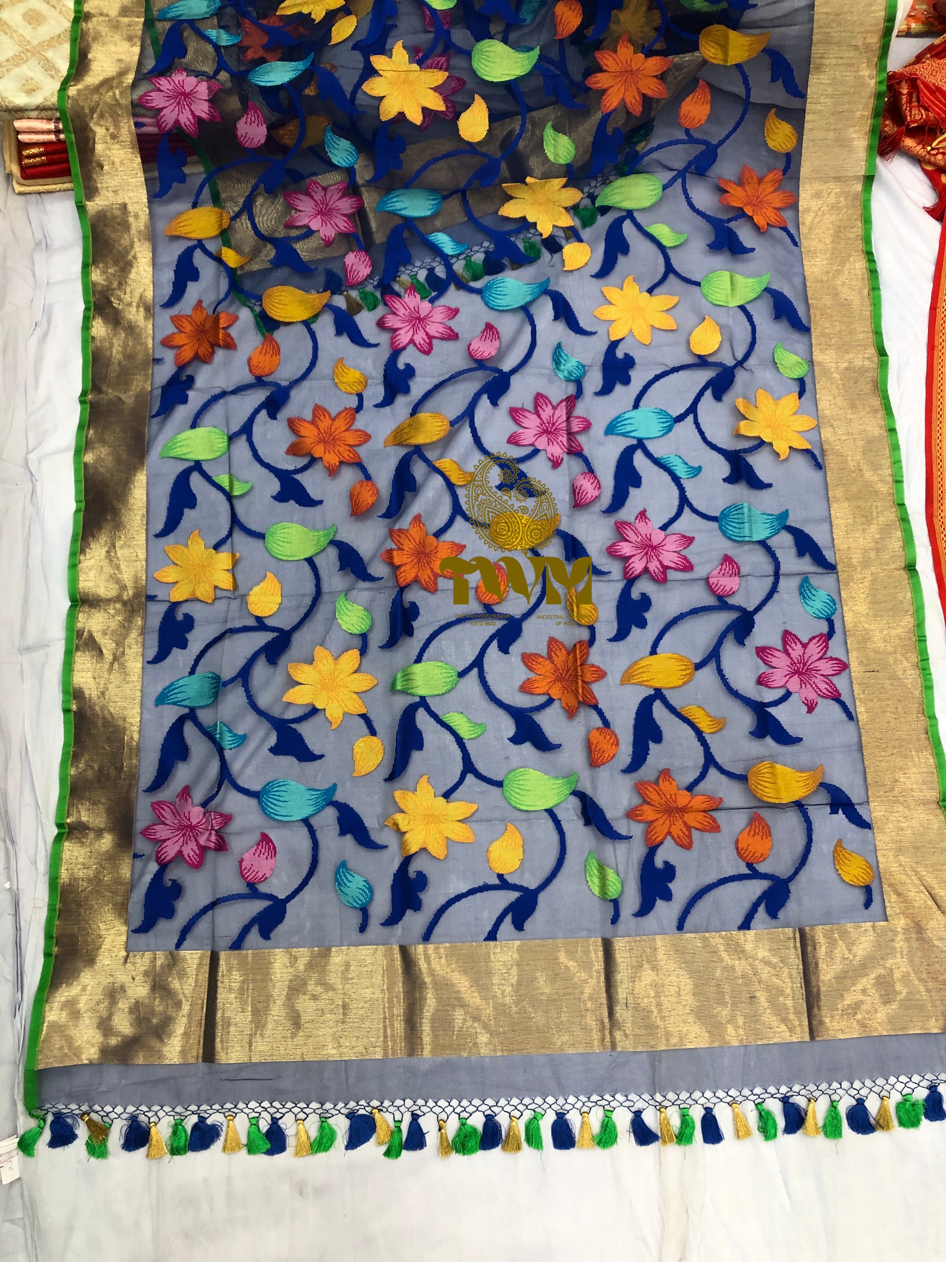 Decorative Dupattas with floral patterns and tassels on a plain background weaving 