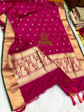 Rani magenta  saree with gold patterns on a white background