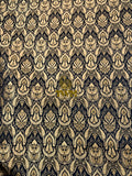 Decorative patterned fabric with intricate design on a black background