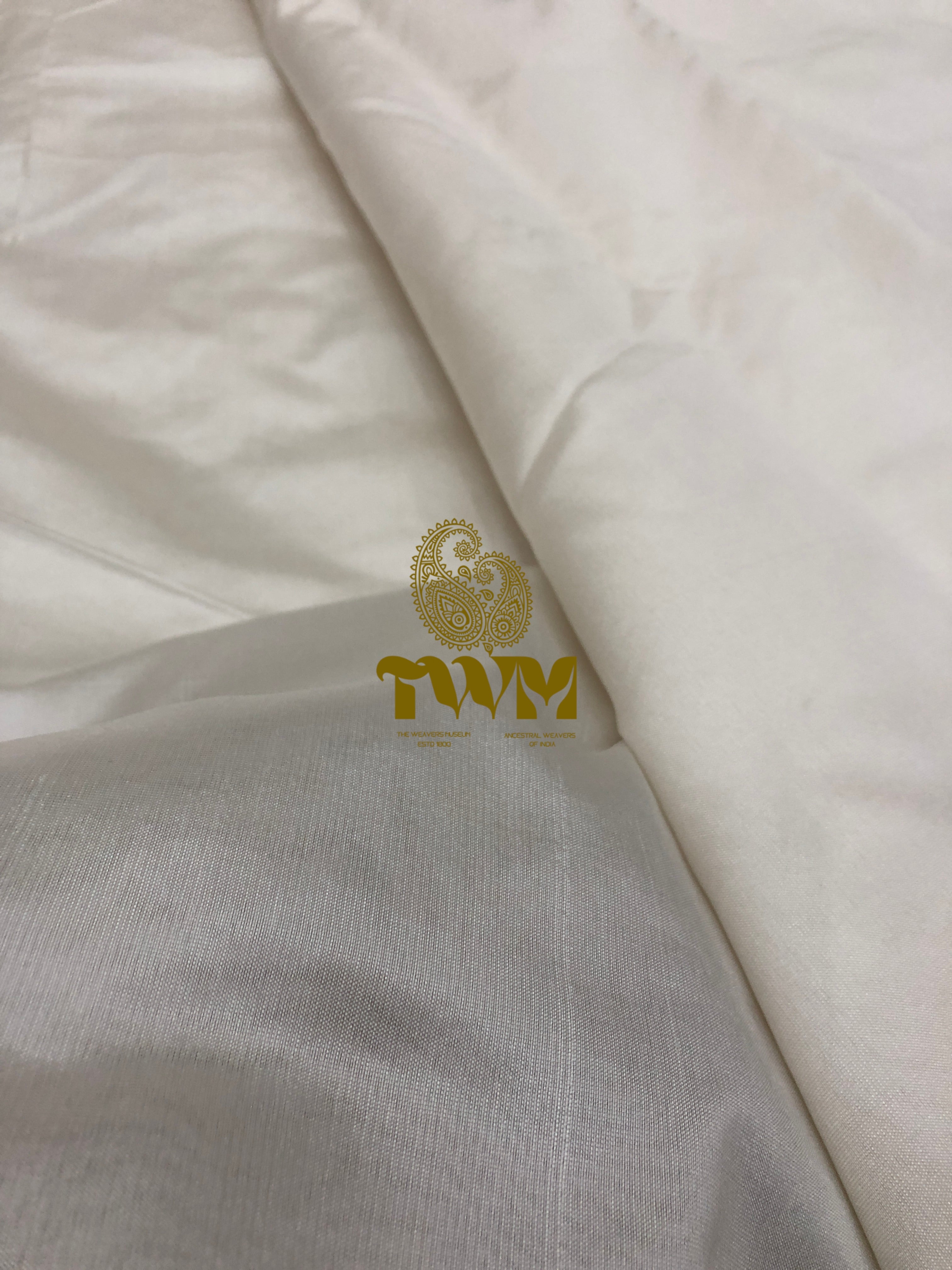 White fabric with a gold logo on a white background