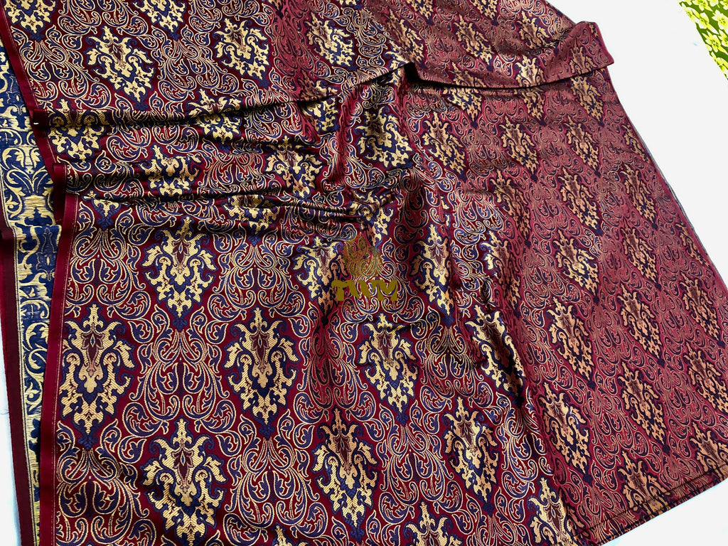 Close-up of a patterned fabric with intricate designs on a white background