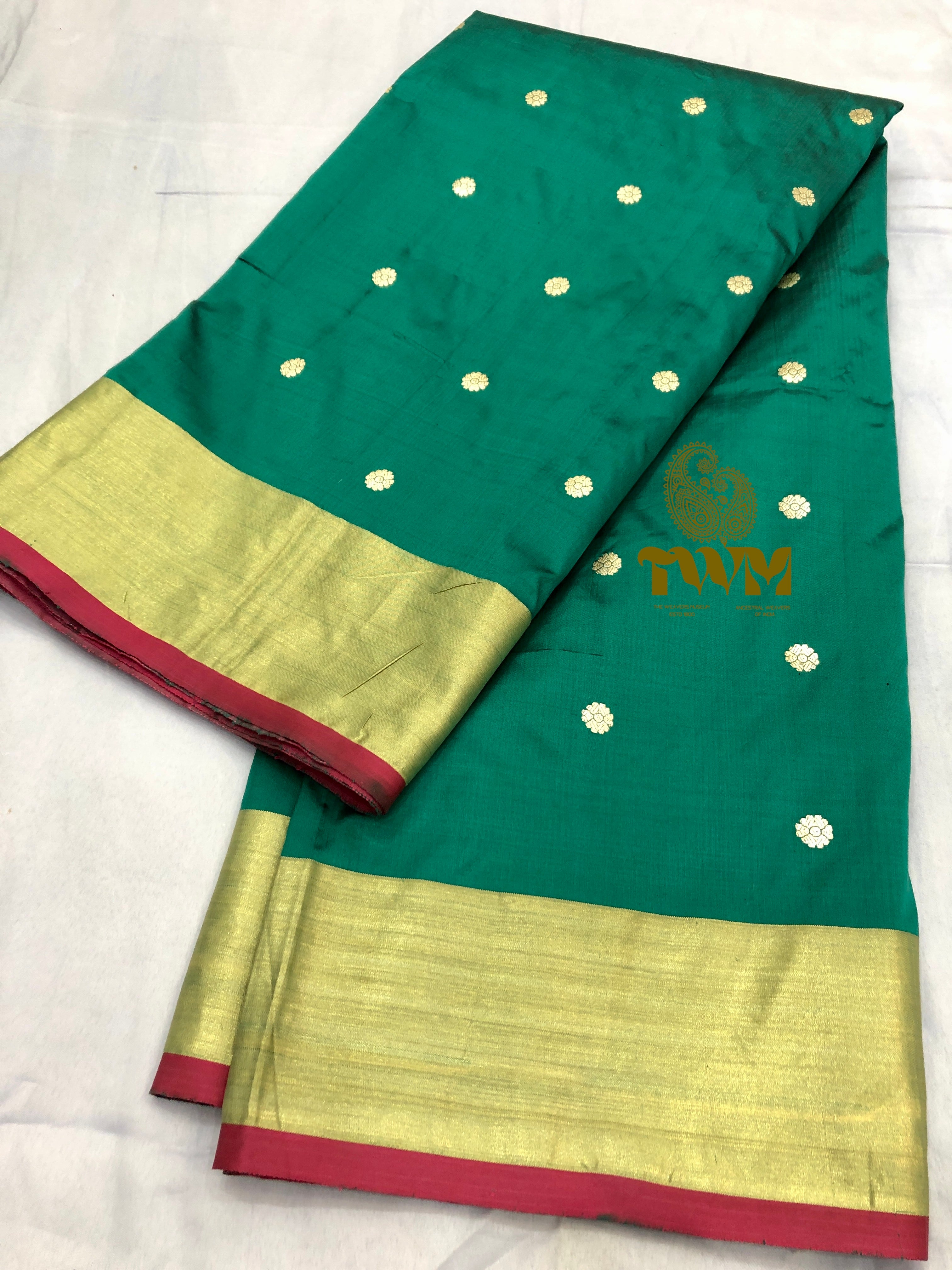 Green Dupatta with gold border and white dot patterns on a white background