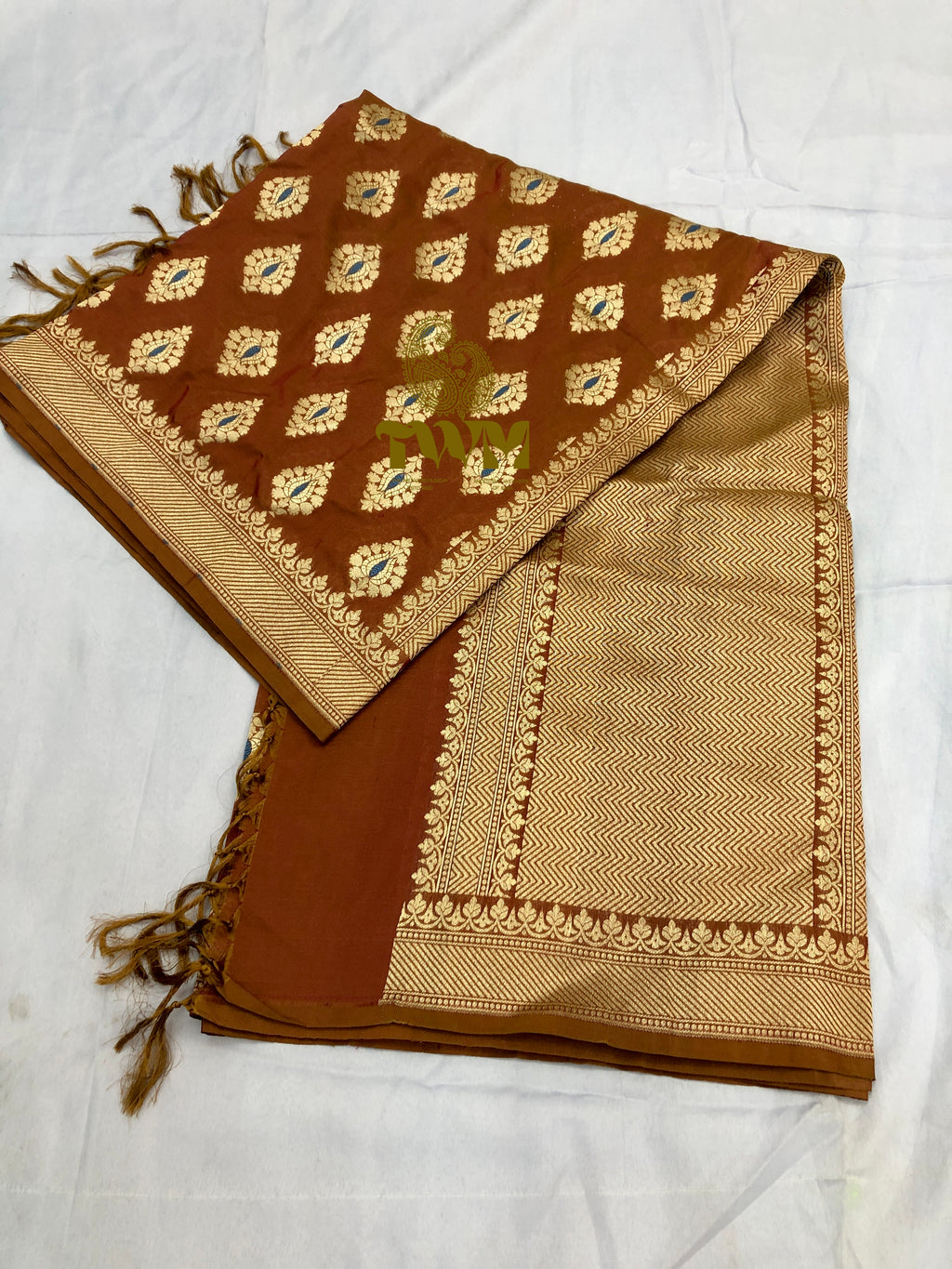 Brown and beige patterned fabric on a white background