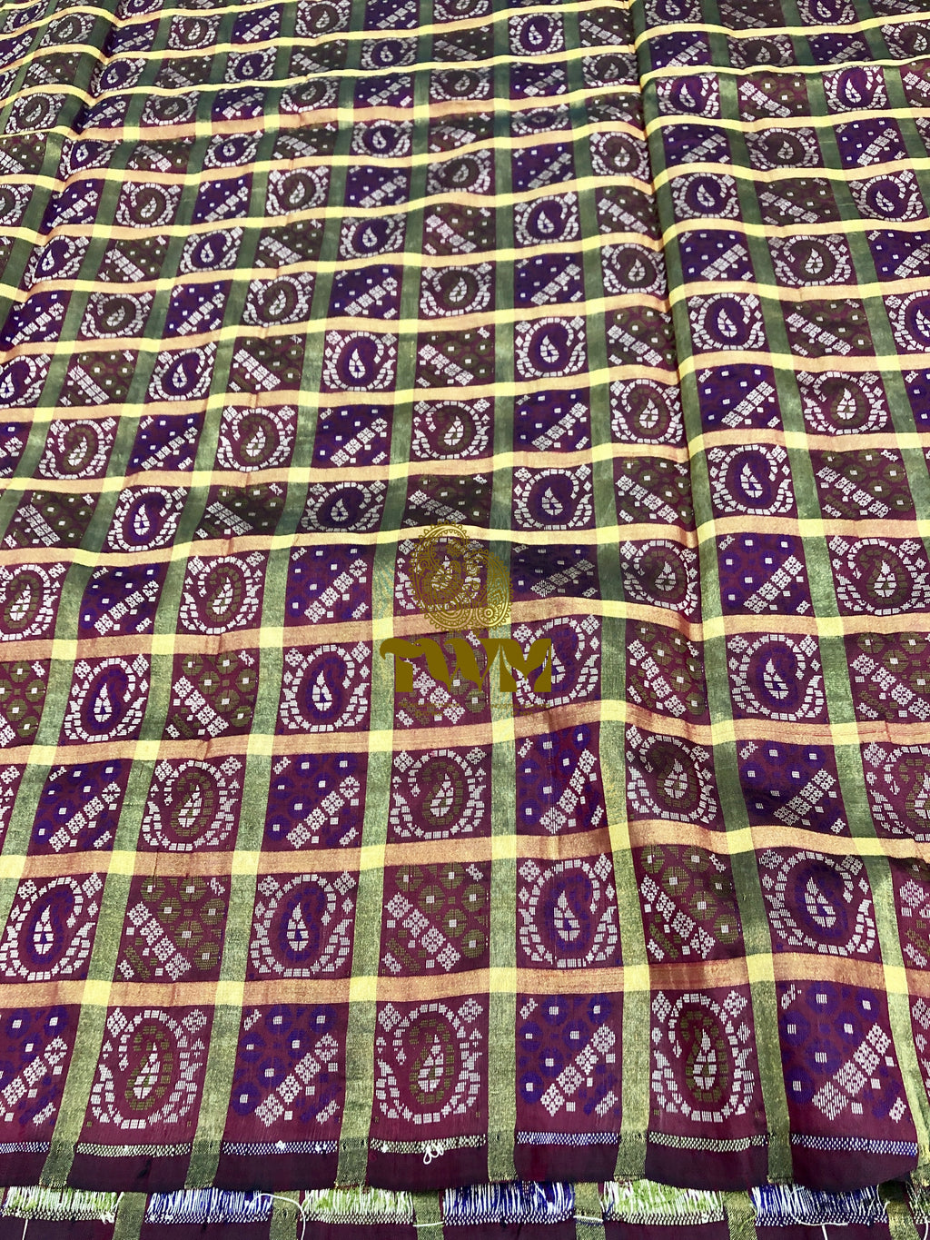 Patterned fabric with purple and green design