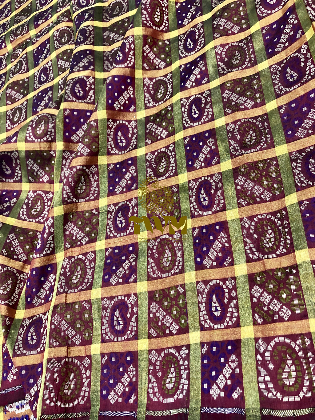 Patterned fabric with purple, green, and gold colors