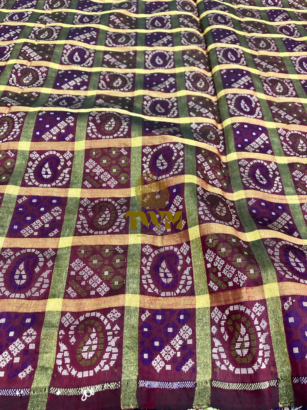 Patterned fabric with purple, green, and yellow colors
